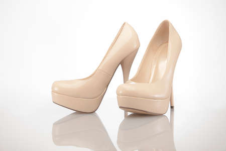 Nude high heel women shoes on white backgroundの写真素材