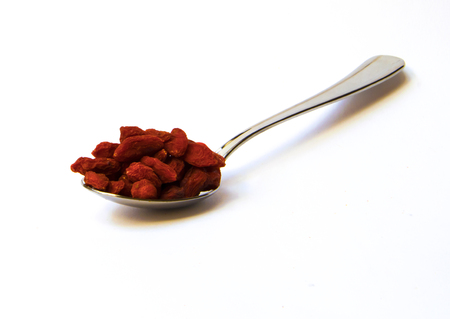 Spoon of dried goji berriesの写真素材