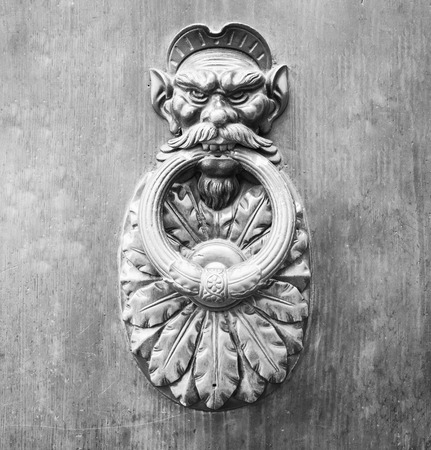Door Knocker on a door, Siena, Tuscany, Italy (black and White).の写真素材