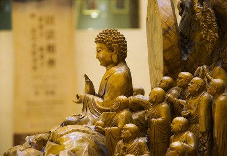 Buddha sculpture image. Taiwanese style wood carving.の写真素材