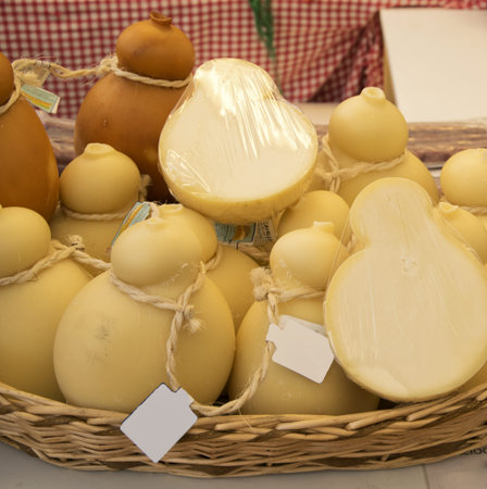 Aged forms of caciocavallo cheese for sale in the italian market.の写真素材