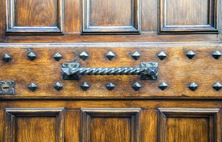 Details of an ancient Italian door in Florence, Italy.の写真素材