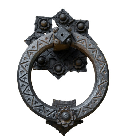 Ancient door knocker isolated on white background.の写真素材
