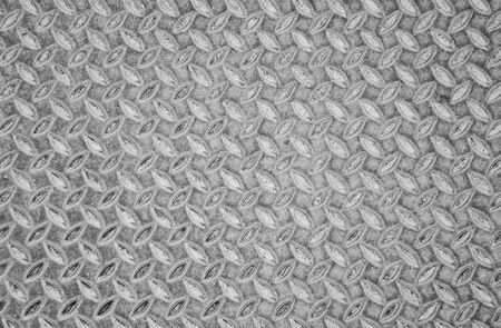 Aged metal seamless steel diamond plate background texture pattern, black and white.の写真素材