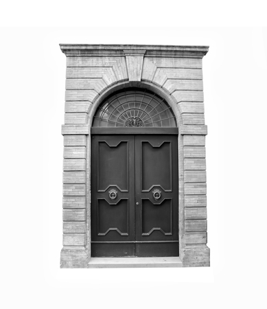 Wooden door in an old Italian house, isolated on white background, clipping path. Black and white.の写真素材