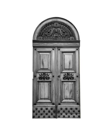 Wooden door in an old Italian house, isolated on white background, clipping path. Black and white.の写真素材