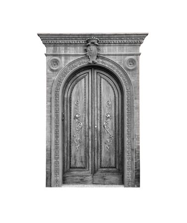 Wooden door in an old Italian house, isolated on white background, clipping path. Black and white.の写真素材