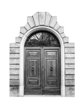 Wooden door in an old Italian house, isolated on white background, clipping path. Black and white.の写真素材