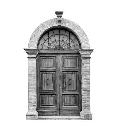 Wooden door in an old Italian house, isolated on white background, clipping path. Black and white.の写真素材