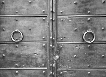 Details of an ancient Italian door, black and white.の写真素材