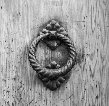 Details of an ancient Italian door, black and white.の写真素材