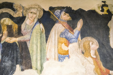 Virgin Mary sacred scenes painted on the wall in Italy.