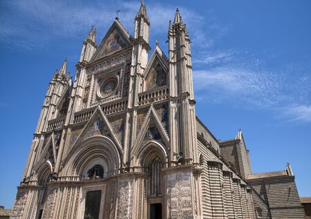 ORVIETO, ITALY - JULY 2017- Orvieto Cathedral (Duomo di Orvieto, Cathedral of Santa Maria Assunta). Sunny day.のeditorial素材