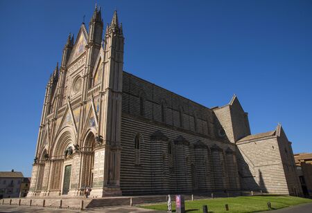 ORVIETO, ITALY - JULY 2017- Orvieto Cathedral (Duomo di Orvieto, Cathedral of Santa Maria Assunta). Sunny day.のeditorial素材
