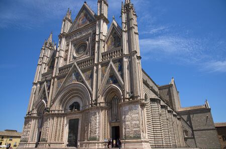 ORVIETO, ITALY - JULY 2017- Orvieto Cathedral (Duomo di Orvieto, Cathedral of Santa Maria Assunta). Sunny day.のeditorial素材
