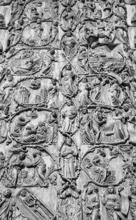 ORVIETO, ITALY - JULY 2017- Close-up of the opulent and elaborated embossed sculptures in the Orvieto Cathedral (Duomo), black and whiteのeditorial素材