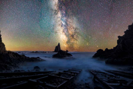The Milky Way above the beach covered by a blanket of starsの写真素材