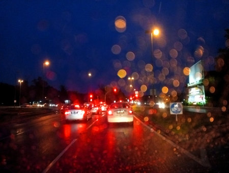 Traffic on a highway in the evening with light reflections on the glass.の写真素材