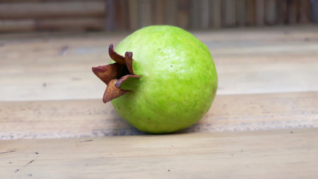 Green guava fruit on wooden table, green guava fruit.の写真素材