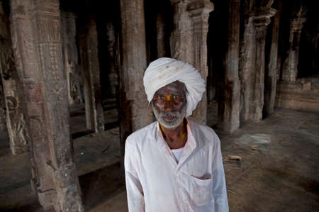 Hampi, India - October 7, 2011: Old Pilgrim with a white turban at the temple at Hampi on the morning of October 7, 2011 Estate Karnataka, Indiaのeditorial素材