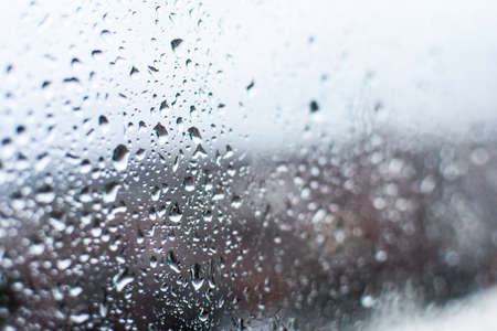 water drops, rain drops on glass and dripping downの写真素材