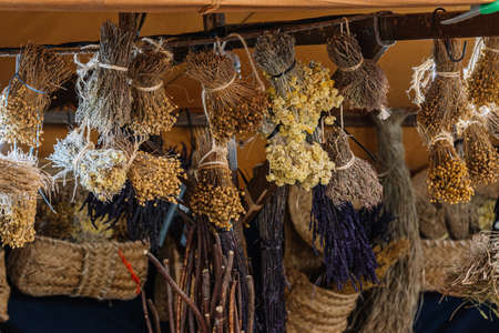 Dry flowers and some herbs for sale in a traditional fair. close upの写真素材