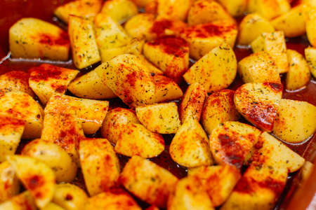 Close up of Delicious baked potatoes with paprika and olive oil. Top viewの写真素材