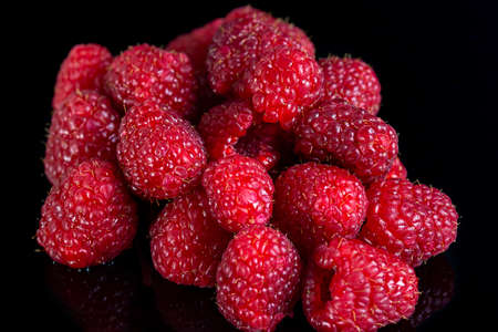 Fresh raspberries close up on a black backgroundの写真素材