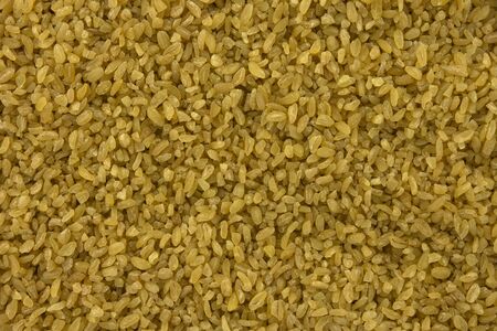 background of dry bulgur wheat from aboveの写真素材