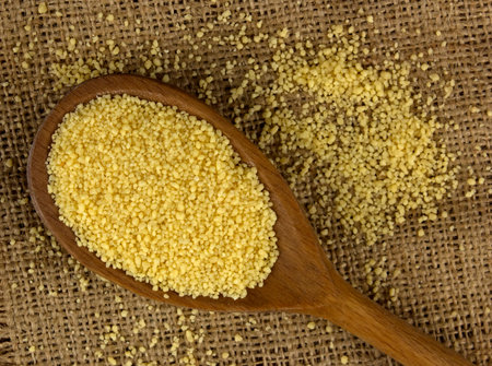 Couscous in a wooden spoon 