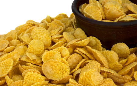 Bowl with cornflakes on white background