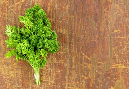 Fresh parsley on wood backgroundの写真素材