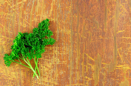 Fresh parsley on wood backgroundの写真素材