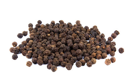 Heap of hot black pepper isolated on white background