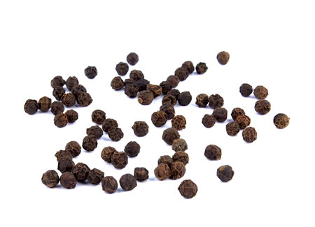 Heap of hot black pepper isolated on white background