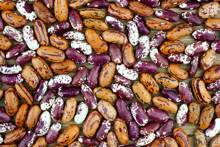 Colored haricot beans closeup on a background, top view, beans background.の写真素材