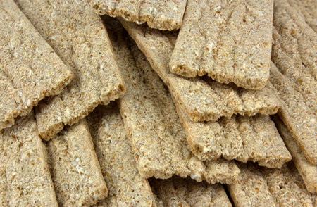 Beautiful background of food crispbread. Crispy dietary fitness bread. Food for weight loss.