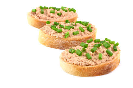 Bread with homemade chicken pate, isolated on white background with spring onionsの写真素材