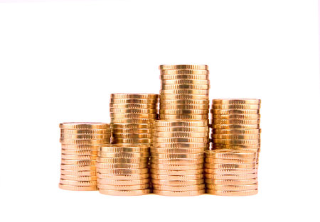 Gold towers made out of gold coins isolated on white