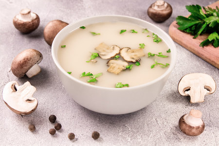 Homemade mushroom soup in a bowl on a gray background. Delicious food.の写真素材