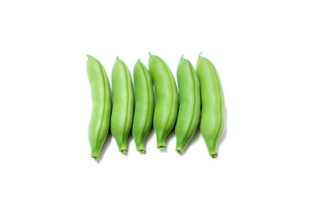 pile of green beans isolated on a white background
