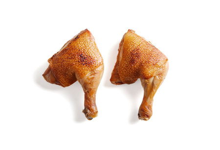 Juicy grilled chicken legs on white background.の写真素材
