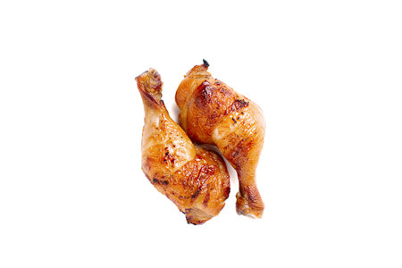 Juicy grilled chicken legs on white background.の写真素材