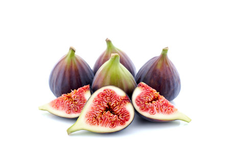 Tasty fresh fig isolated on white background