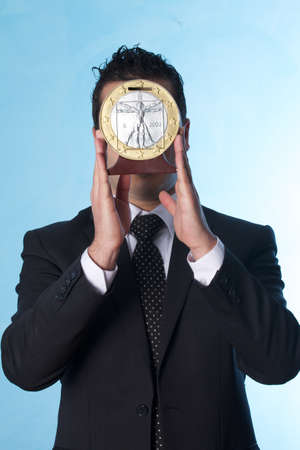 business man with coin replicaの写真素材