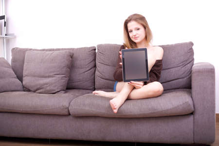 BEAUTIFUL GIRL showing digital tabletの写真素材