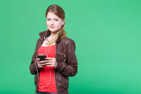 young woman listening musicの写真素材