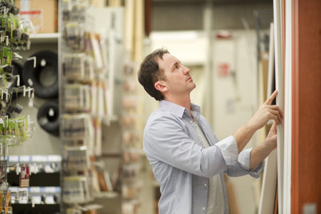 adult man in hardware store