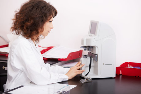 Optometrist performing visual field test