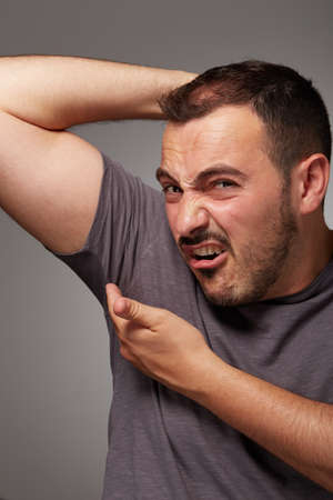 adult man taste his body odorの写真素材